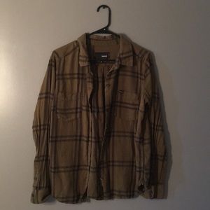 Green and black button down.